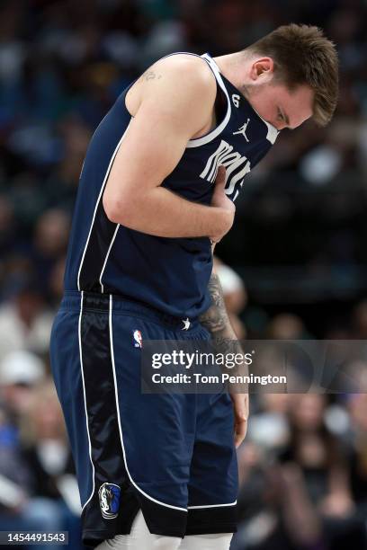 Luka Doncic of the Dallas Mavericks coughs while taking on the Boston Celtics in the second quarter at American Airlines Center on January 05, 2023...