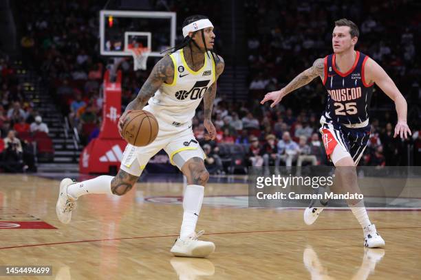 Jordan Clarkson of the Utah Jazz controls the ball ahead of Garrison Mathews of the Houston Rockets during the first half at Toyota Center on January...