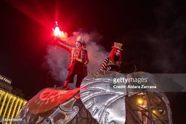 Participants with a mechanical elephant attend the Three Kings Parade in Madrid on January 05, 2023 in Madrid, Spain.