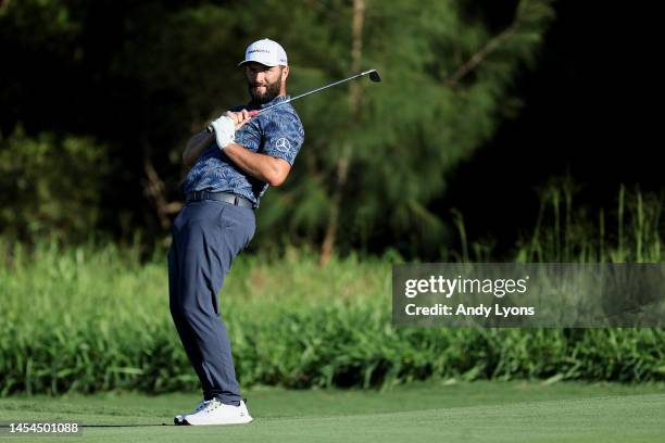 Jon Rahm of Spain reacts to his chip onto the 15th greduring the first round of the Sentry Tournament of Champions at Plantation Course at Kapalua...