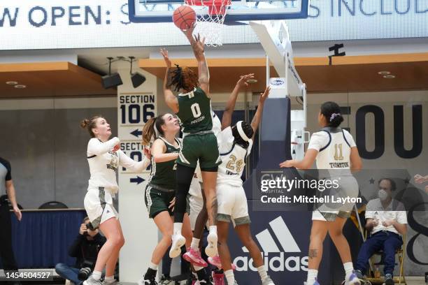 Narrie Dodson of the Manhattan Lady Jaspers takes a shot during a womens basketball game against the George Washington Colonials at the Smith Center...