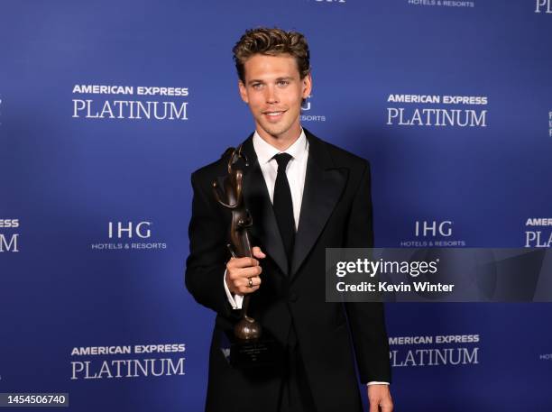 Austin Butler poses in the press room with an award during the 2023 Palm Springs International Film Festival Awards Night Gala at Palm Springs...