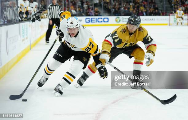 Sidney Crosby of the Pittsburgh Penguins skates against William Karlsson of the Vegas Golden Knights during the second period at T-Mobile Arena on...