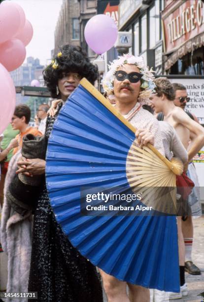 Portrait of American gay liberation activist Marsha P Johnson , along with unidentified others, on the corner of Christopher Street and 7th Avenue...