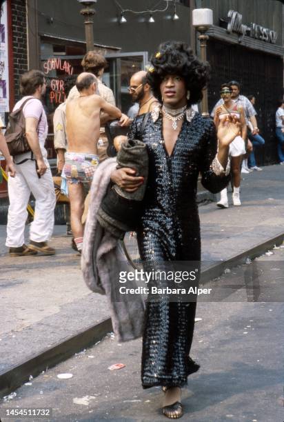 American gay liberation activist Marsha P Johnson on the corner of Christopher Street and 7th Avenue during the Pride March , New York, June 27, 1982.