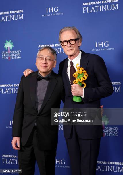 Kazuo Ishiguro and Bill Nighy, winner of the International Star Award, pose backstage during the 34th Annual Palm Springs International Film Awards...