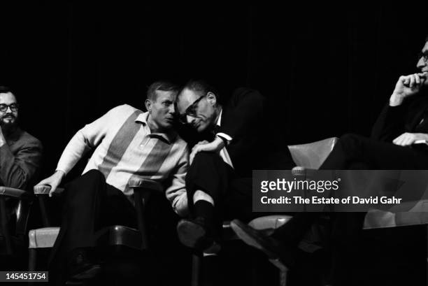 Russian poet Yevgeny Yevtushenko and playwright and essayist Arthur Miller confer on stage in November 1966 at an event for Mr. Yevtushenko at Queens...