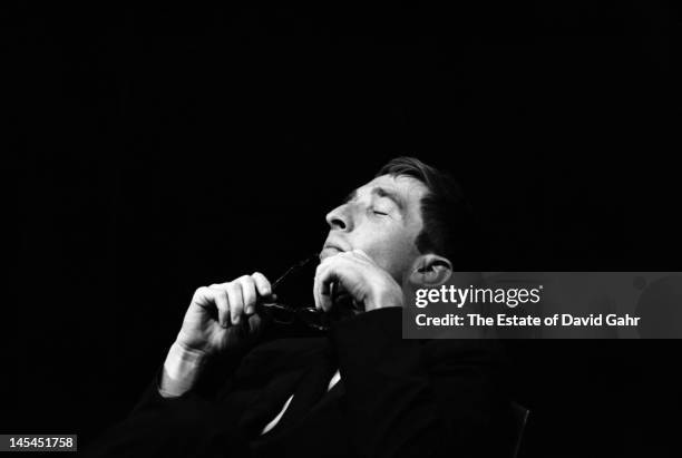 Writer and critic John Updike on stage in November 1966 at an event for Russian poet Yevgeny Yevtushenko at Queens College in New York City, New York.