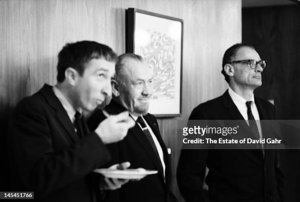 Writer and critic John Updike , writer John Steinbeck , and playwright and essayist Arthur Miller attend an event for Russian poet Yevgeny...