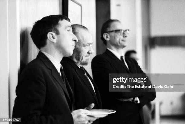 Writer and critic John Updike , writer John Steinbeck , and playwright and essayist Arthur Miller attend an event for Russian poet Yevgeny...