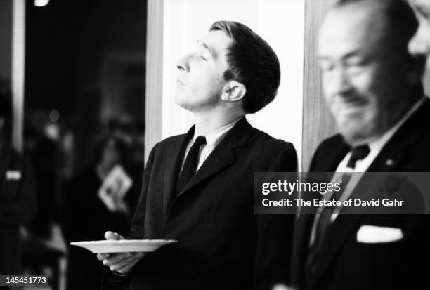 Writer and critic John Updike and writer John Steinbeck attend an event for Russian poet Yevgeny Yevtushenko in November1966 at Queens College in New...