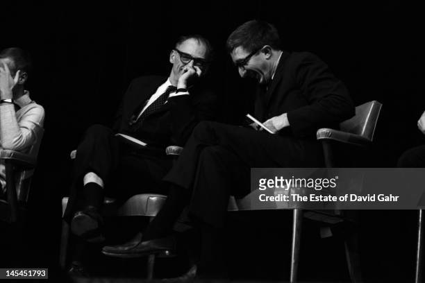 Playwright and essayist Arthur Miller and writer and critic John Updike on stage in November 1966 at an event for Russian poet Yevgeny Yevtushenko at...