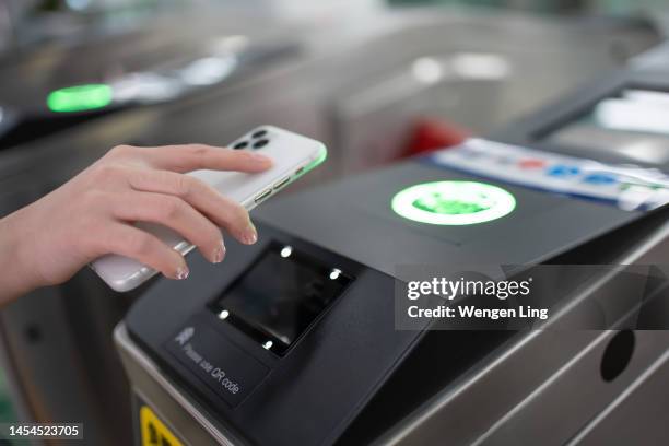 pay for the subway with your mobile phone - near field communication stock pictures, royalty-free photos & images