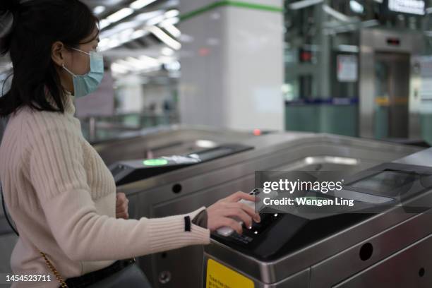 mobile phone to scan the subway - fare stock pictures, royalty-free photos & images