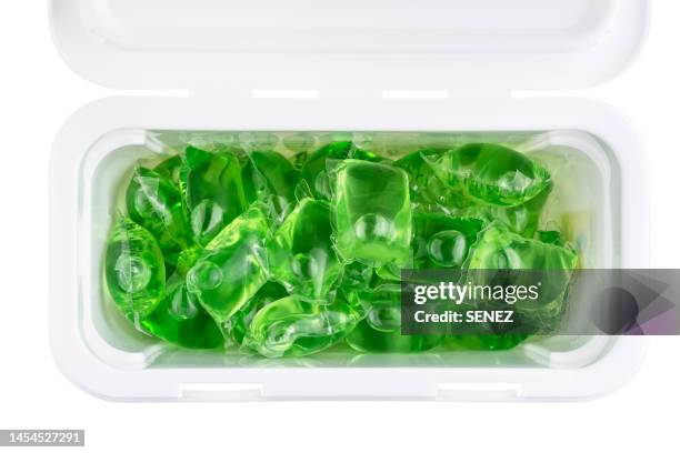 gel capsules with laundry detergent in plastic containers box - wasserglas stockfoto's en -beelden