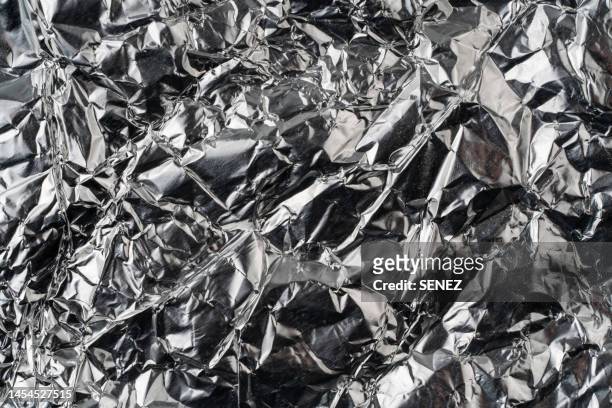 aluminum foil texture close up,full frame shot of abstract background - foil texture silver stock pictures, royalty-free photos & images