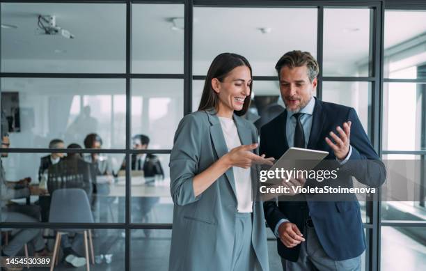 business people in the office. - two people standing stock pictures, royalty-free photos & images