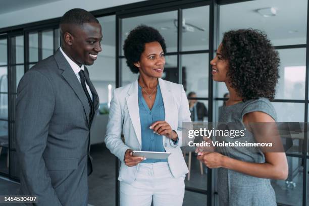 business people in the office. - three people standing stock pictures, royalty-free photos & images