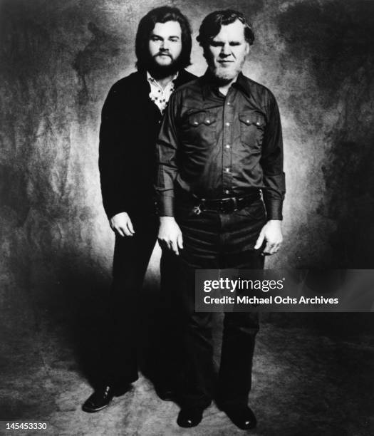 Bluegrass musicians Doc Watson and his son Merle Watson pose for a portrait in circa 1975.