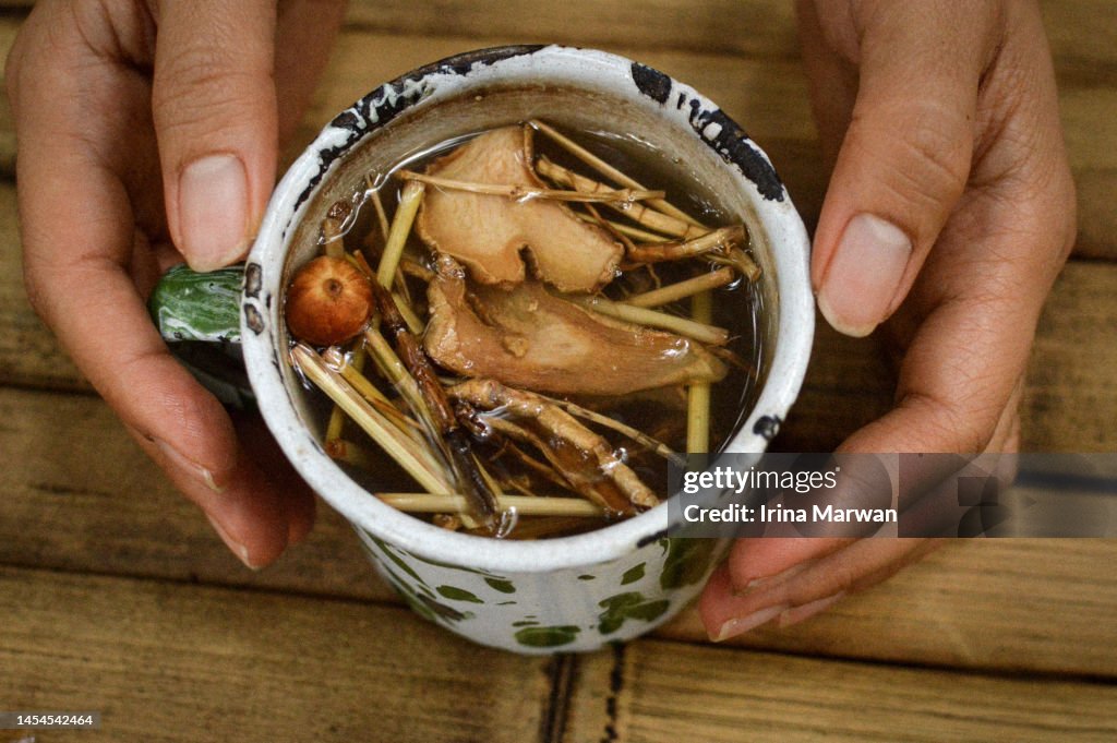 Drinking traditional herbal drink