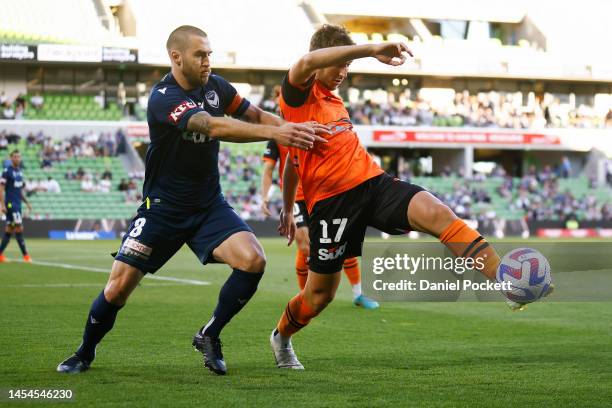Carlo Armiento of the Roar and Joshua Brillante of the Victory contest the ball during the round 11 A-League Men's match between Melbourne Victory...