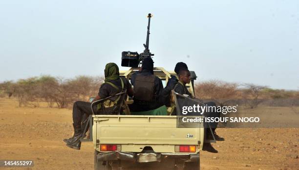 Niger's army forces patrol near the new UNHCR Imbaidou refugee camp, on May 29 near Ayorou, north-west of Niamey in Niger, where Malian refugees have...
