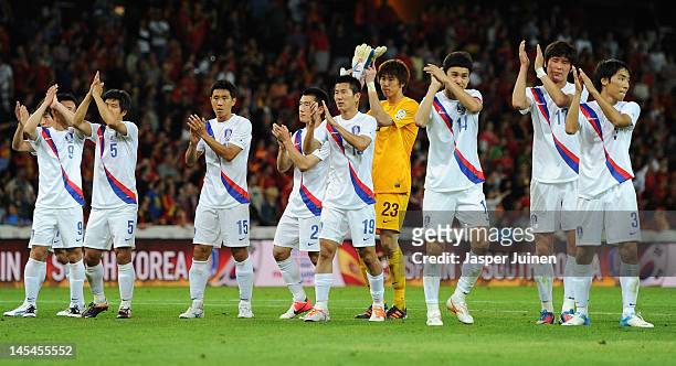Korea Republic players greet their fans at the end of the international friendly match between Spain and Korea Republic on May 30, 2012 in Bern,...