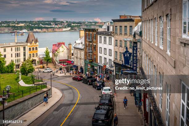 shopping street and saint lawrence river in background in québec city in canada - st lawrence river stock pictures, royalty-free photos & images