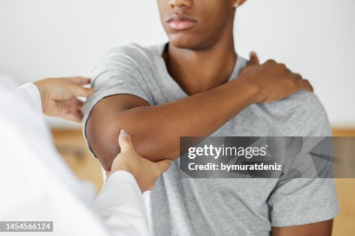 Doctor checking patient with elbow to determine the cause of illness