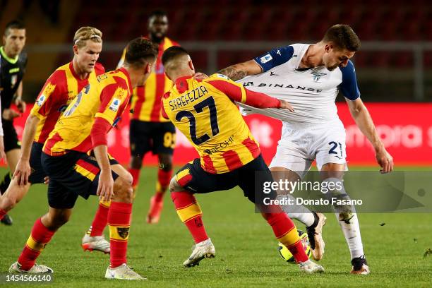 Sergej Milinković-Savić of SS Lazio and Gabriel Strefezza of US Lecce during the Serie A match between US Lecce and SS Lazio at Stadio Via del Mare...