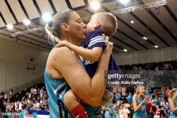 Lauren Jackson of the Flyers celebrates with her son after the game during the round nine WNBL match between Southside Flyers and Bendigo Spirit at...