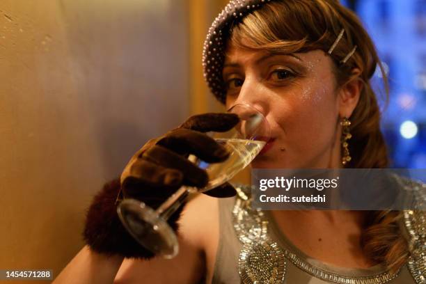 the beautiful woman in the bar. - speakeasy stock pictures, royalty-free photos & images