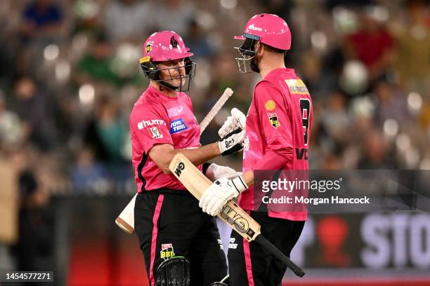 Dan Christian and James Vince of the Sixers celebrate winning the Men's Big Bash League match between the Melbourne Stars and the Sydney Sixers at...