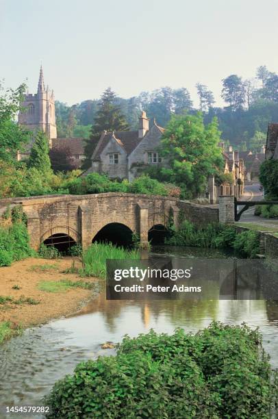 castle combe with bybrook river, wiltshire, uk - castle combe stock pictures, royalty-free photos & images
