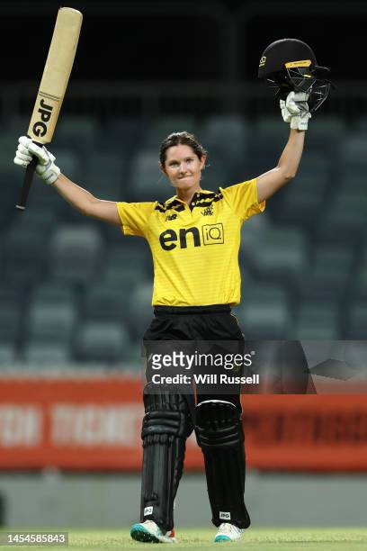 Maddy Darke of Western Australia raises her bat after scoring one hundred runs during the WNCL match between Western Australia and South Australia at...