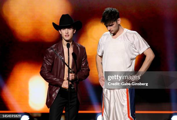 Adult film actors Sean Ford and Leo Louis accept the Best Featurette award during the 2023 GayVN Awards show at Resorts World Las Vegas on January...