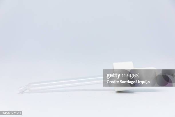 close-up of glass pipette - pipette stock pictures, royalty-free photos & images