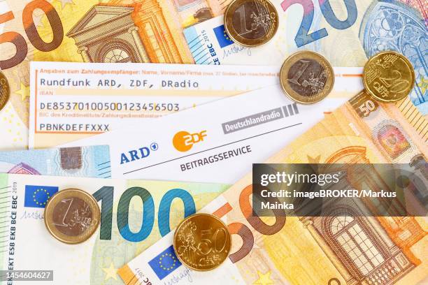 contribution service of ard and zdf rundfunkgebuehr gez with money in stuttgart, germany - fees stock pictures, royalty-free photos & images