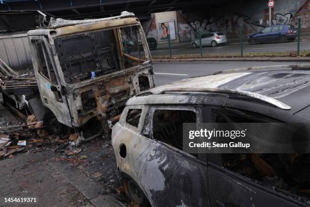 Truck and car that went up in flames during rioting on New Year's Eve stand on January 06, 2023 in Berlin, Germany. Berlin politicians are debating...