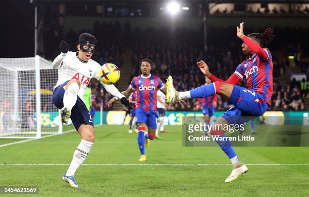 Son Heung-Min of Tottenham Hotspur battles for possession with Michael Olise of Crystal Palace during the Premier League match between Crystal Palace...