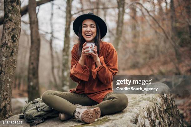 woman sitting alone in nature - sitting on ground stock pictures, royalty-free photos & images