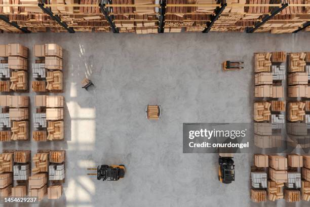 high angle view of warehouse with forklift, pallet, agv and cardboard boxes - opslagruimte stockfoto's en -beelden