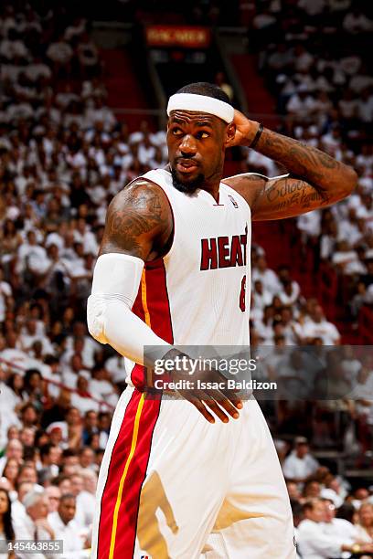 LeBron James of the Miami Heat adjusts his headband while playing against the Boston Celtics in Game Two of the Eastern Conference Finals during the...