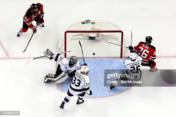 Anton Volchenkov of the New Jersey Devils , scores a goal in the second period against Jonathan Quick of the Los Angeles Kings as David Clarkson,...