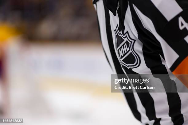 Detail view of the NHL shield logo on a referees jersey during the third period of an NHL game between the Nashville Predators and the Colorado...