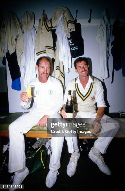 Notts players Clive Rice and Richard Hadlee celebrate in the dressing room after Notts had beaten Glamorgan to win the 1987 County Cricket...