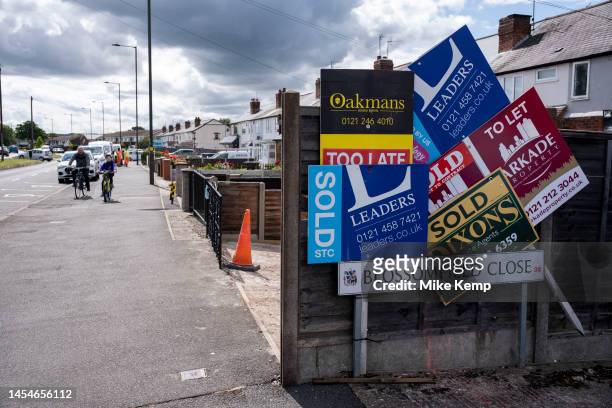 Various estate agents for sale and sold signs in the Hawkesley area near Kings Norton area on 3rd July 2023 in Birmingham, United Kingdom. Housing in...