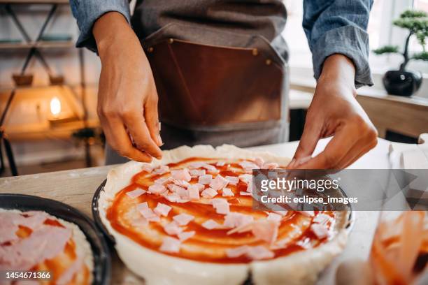 making pizza at home - pizza with ham stock pictures, royalty-free photos & images