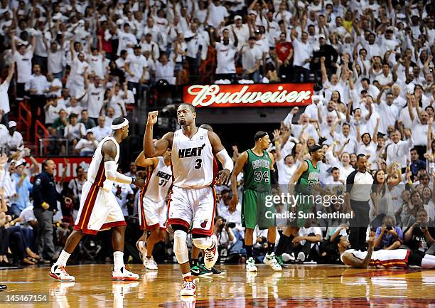 Miami Heat's Dwyane Wade celebrates a run against the Boston Celtics in the third quarter during Game 2 of the NBA Eastern Conference finals at...