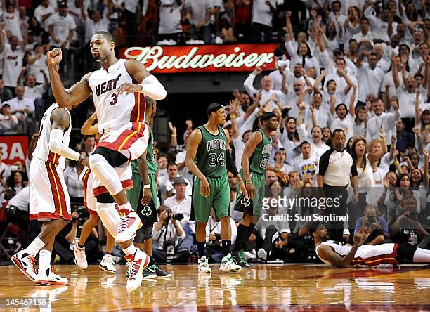 Miami Heat's Dwyane Wade celebrates a run against the Boston Celtics in the third quarter during Game 2 of the NBA Eastern Conference finals at...